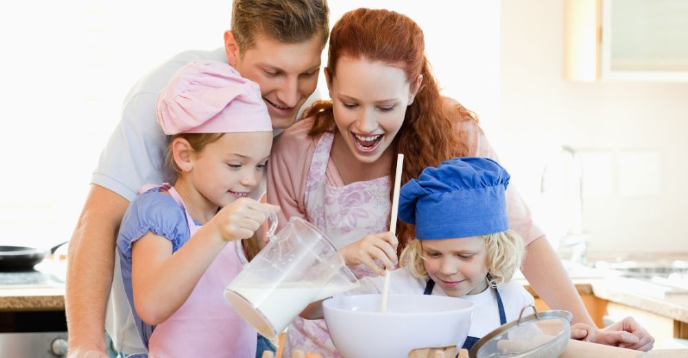 Family baking together smiling