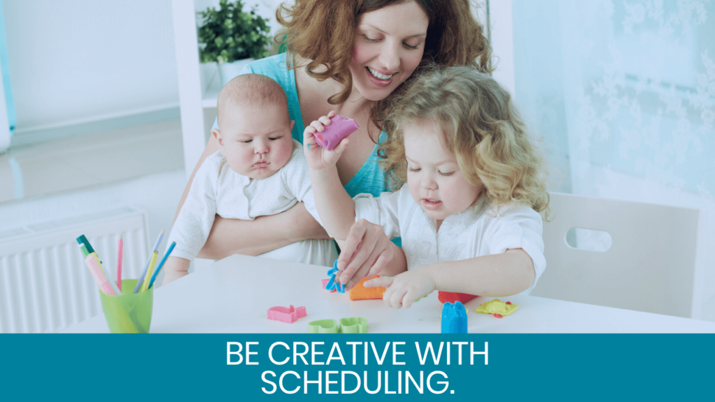 Woman playing with a baby and toddler