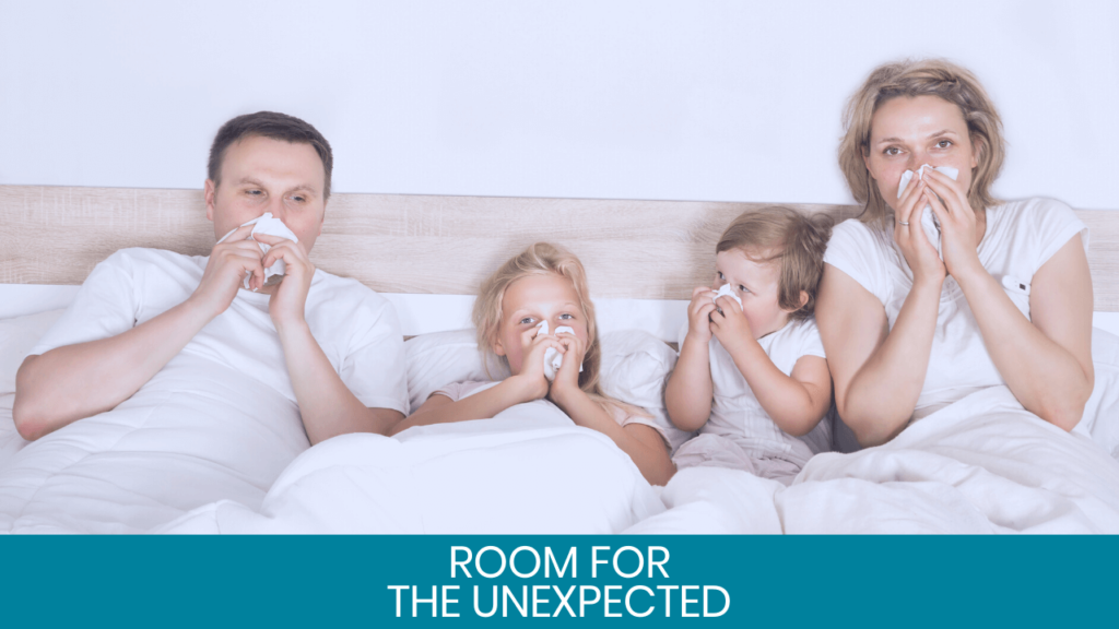 Family on bed blowing their noses