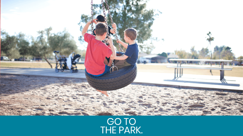 Kids rocking on a tire swing