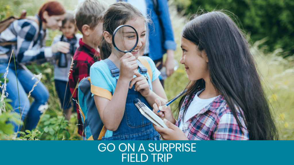 Girl with magnifying glass looking at other girl