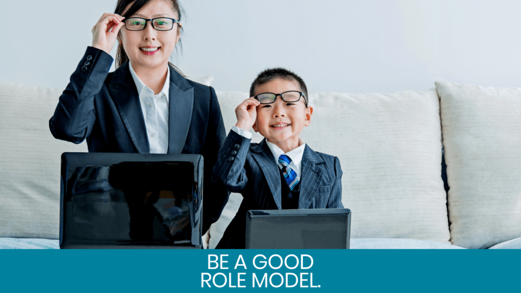 Mom and boy in suits holding their glasses and smiling