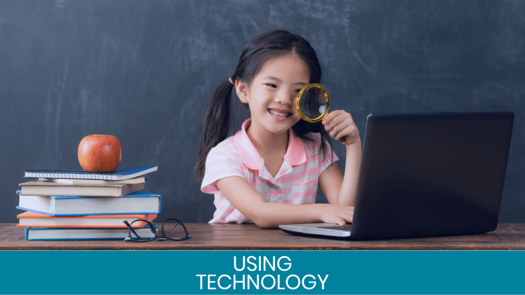 Girl smiling with magnifying glass looking at a laptop